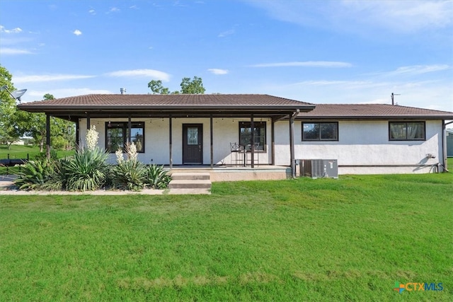 view of front of house featuring a porch, a front yard, and central AC