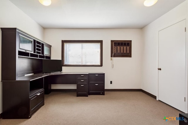 office area featuring a wall mounted AC and light colored carpet