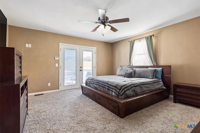 carpeted bedroom featuring ceiling fan, access to outside, and french doors