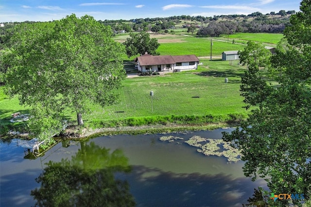 drone / aerial view with a rural view and a water view