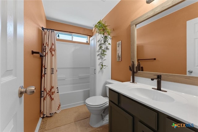 full bath with vanity, tile patterned floors, toilet, and shower / bath combo with shower curtain