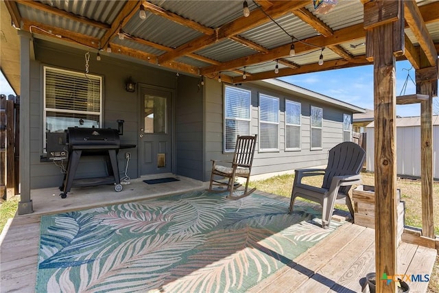 view of patio / terrace featuring grilling area and fence