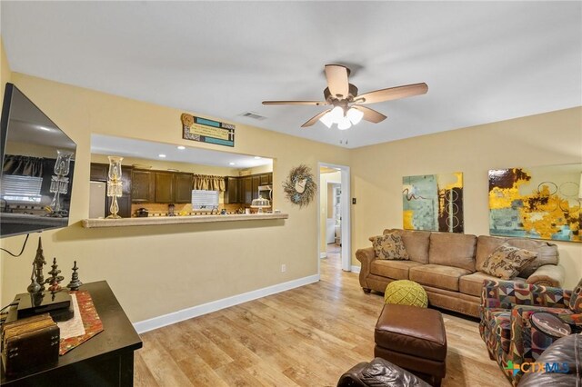 501 Hathaway St, Victoria, TX 77904 - living area with a ceiling fan and light wood finished floors