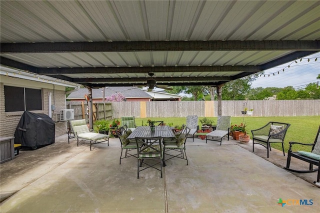 501 Hathaway St, Victoria, TX 77904 - fenced backyard featuring grilling area, a patio, outdoor dining area, and a ceiling fan