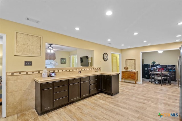 501 Hathaway St, Victoria, TX 77904 - kitchen featuring light wood-style floors, dark brown cabinetry, light countertops, recessed lighting, and a ceiling fan