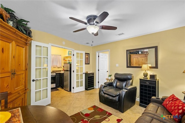 501 Hathaway St, Victoria, TX 77904 - living room featuring french doors, light tile patterned floors, and a ceiling fan