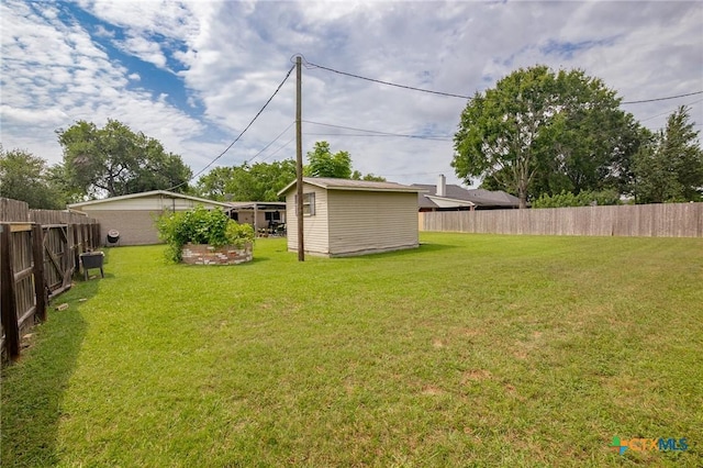 501 Hathaway St, Victoria, TX 77904 - fenced backyard featuring a storage unit