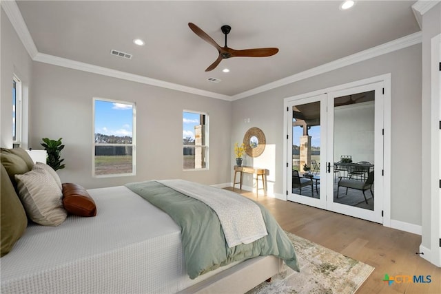 713 San Gabriel Ranch Rd, Liberty Hill, TX 78641 - bedroom featuring access to exterior, french doors, wood finished floors, multiple windows, and recessed lighting