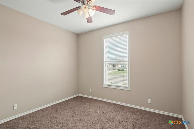 carpeted empty room with ceiling fan