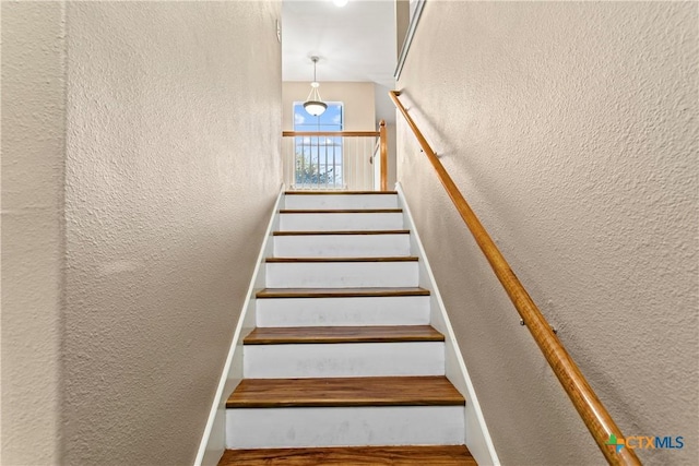 229 Rocky Ridge Dr, New Braunfels, TX 78130 - stairway with a textured wall and wood finished floors