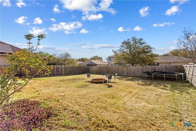 229 Rocky Ridge Dr, New Braunfels, TX 78130 - view of yard featuring a trampoline and a fire pit