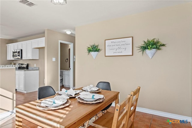 229 Rocky Ridge Dr, New Braunfels, TX 78130 - dining room featuring light tile patterned floors and baseboards