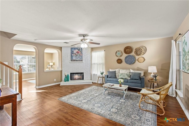 229 Rocky Ridge Dr, New Braunfels, TX 78130 - living room featuring a ceiling fan, healthy amount of natural light, baseboards, and wood finished floors