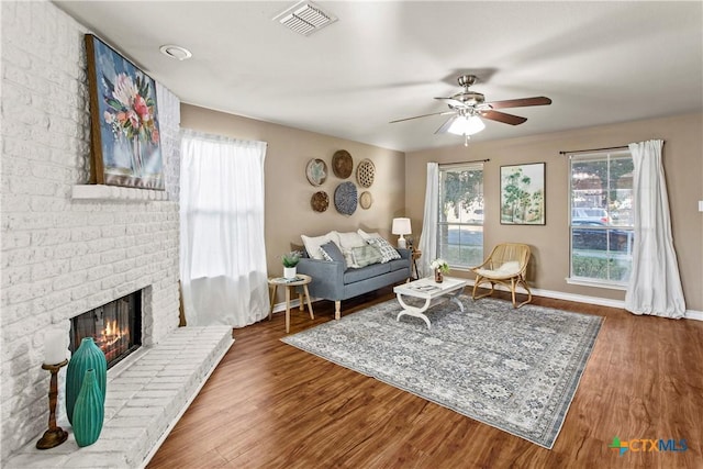 229 Rocky Ridge Dr, New Braunfels, TX 78130 - living room featuring a ceiling fan, wood finished floors, baseboards, and a fireplace