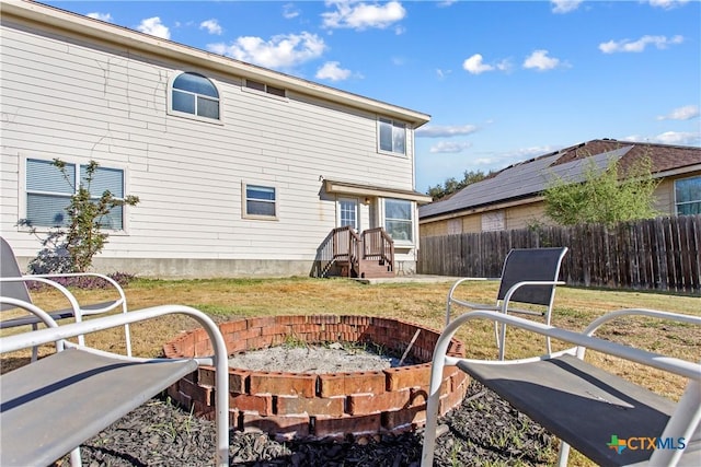 229 Rocky Ridge Dr, New Braunfels, TX 78130 - rear view of house featuring an outdoor fire pit