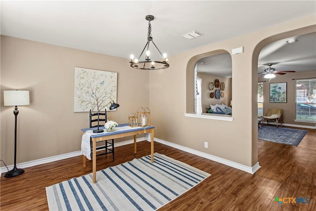 229 Rocky Ridge Dr, New Braunfels, TX 78130 - office space featuring baseboards, wood finished floors, a chandelier, arched walkways, and a ceiling fan