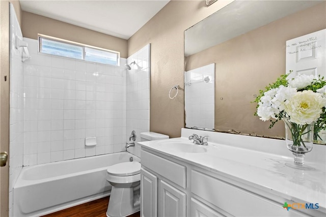 229 Rocky Ridge Dr, New Braunfels, TX 78130 - bathroom featuring toilet, vanity, bathing tub / shower combination, and wood finished floors