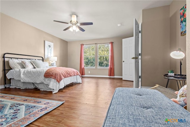 229 Rocky Ridge Dr, New Braunfels, TX 78130 - bedroom featuring wood finished floors, baseboards, and ceiling fan