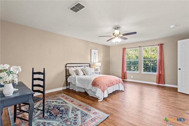 229 Rocky Ridge Dr, New Braunfels, TX 78130 - bedroom with wood finished floors, baseboards, and a ceiling fan
