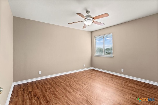 229 Rocky Ridge Dr, New Braunfels, TX 78130 - empty room featuring baseboards, ceiling fan, and wood finished floors