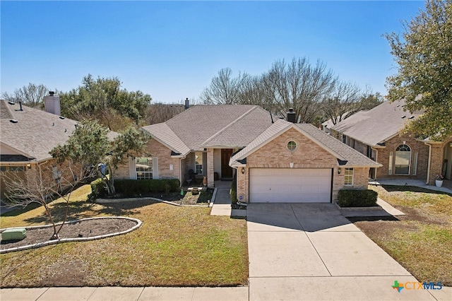 view of front of house with brick siding, a shingled roof, a front lawn, concrete driveway, and an attached garage