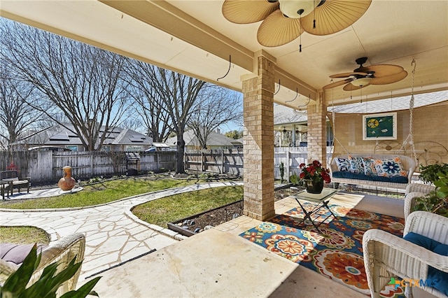 view of patio featuring ceiling fan and a fenced backyard