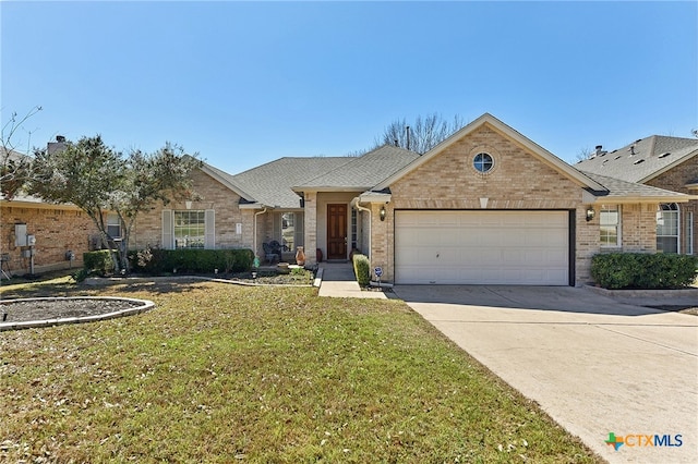 ranch-style home with brick siding, a front lawn, concrete driveway, and a garage