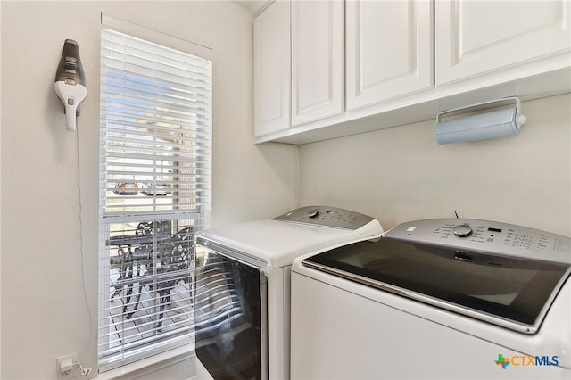 laundry area featuring cabinet space and washing machine and dryer