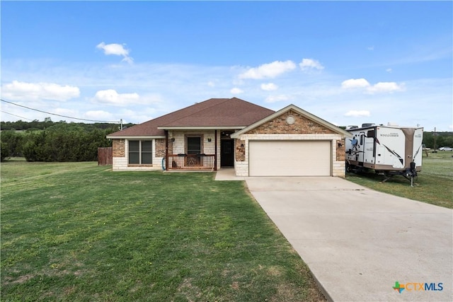 view of front of home featuring concrete driveway, brick siding, an attached garage, and a front yard