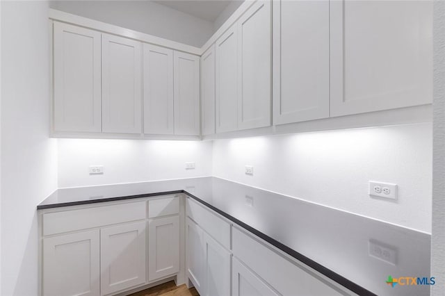 kitchen featuring white cabinets