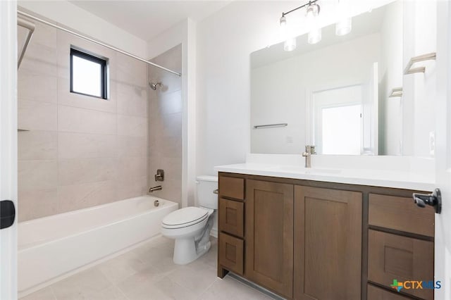 full bathroom featuring vanity, toilet, and tiled shower / bath combo