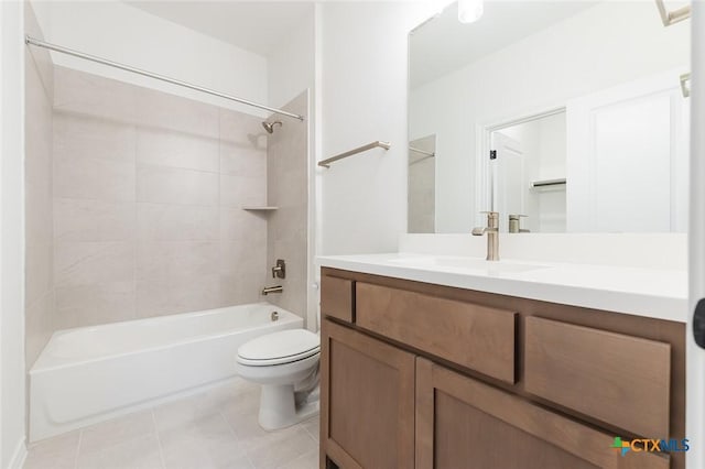 full bathroom with tiled shower / bath combo, vanity, tile patterned floors, and toilet