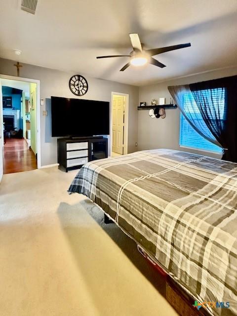 bedroom with carpet floors and ceiling fan