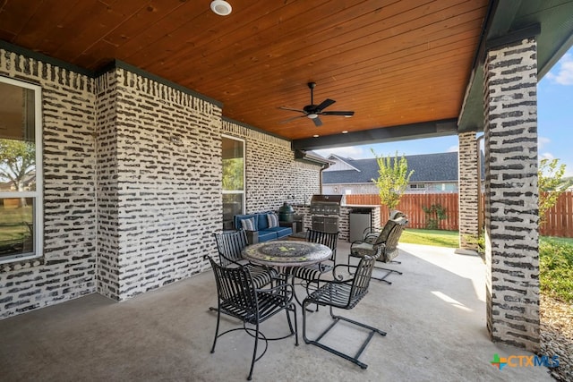 view of patio with ceiling fan and a grill