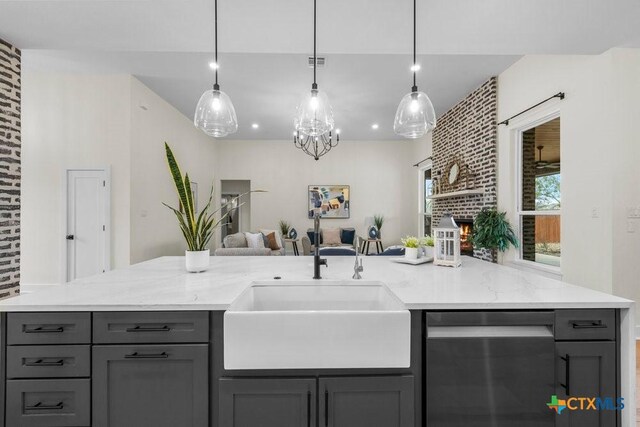 kitchen featuring light hardwood / wood-style floors, a center island with sink, white cabinets, black appliances, and backsplash