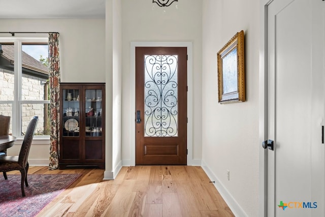 foyer with light wood-type flooring