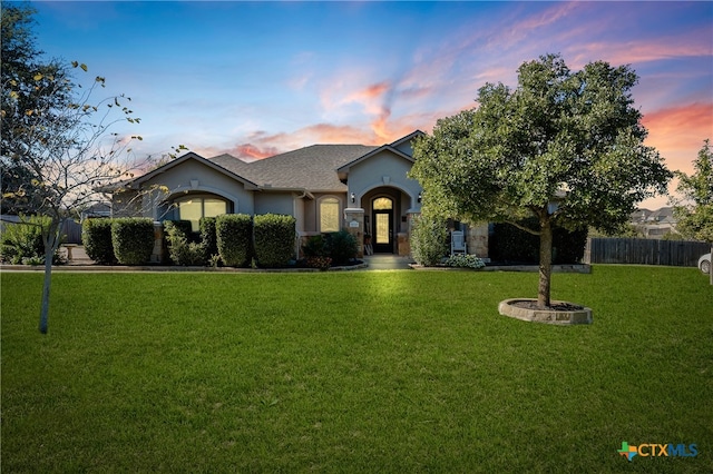 view of front facade with a lawn