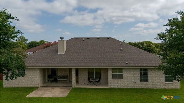 2004 Excel Dr, Killeen, TX 76542 - rear view of house with a patio area, a shingled roof, brick siding, and a yard