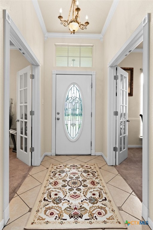2004 Excel Dr, Killeen, TX 76542 - carpeted entryway featuring french doors, a chandelier, tile patterned flooring, and ornamental molding