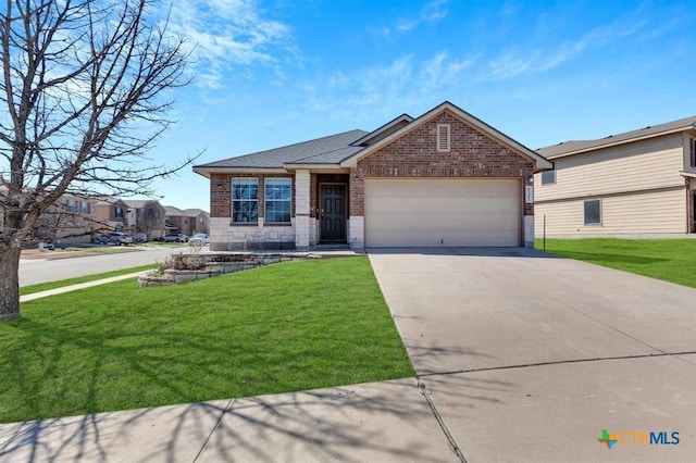 9301 Bellgrove Ct, Killeen, TX 76542 - view of front of house with brick siding, a garage, a front lawn, and driveway