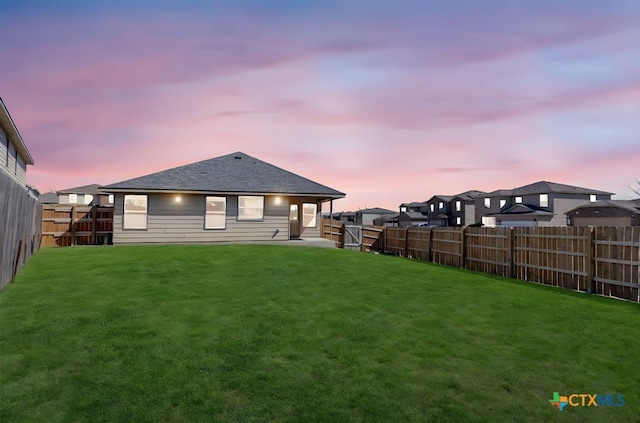 9301 Bellgrove Ct, Killeen, TX 76542 - back of house at dusk with a patio and a shingled roof