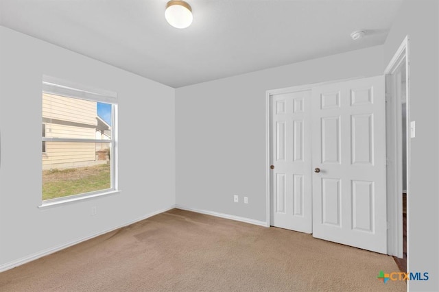 9301 Bellgrove Ct, Killeen, TX 76542 - unfurnished bedroom with carpet flooring, a closet, and baseboards