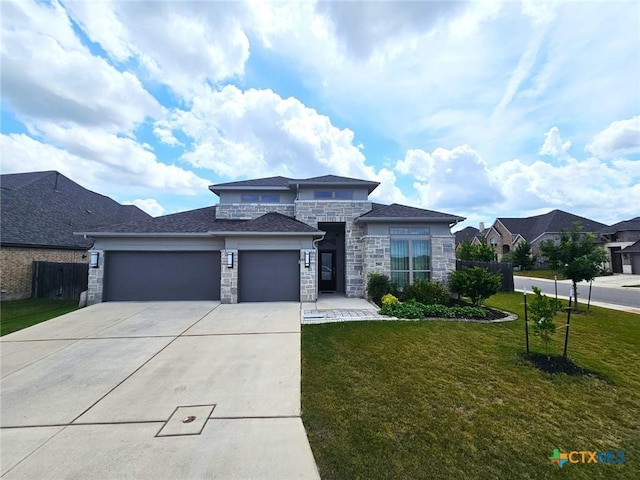 2961 Grove Way, Seguin, TX 78155 - prairie-style home featuring stone siding, an attached garage, and concrete driveway