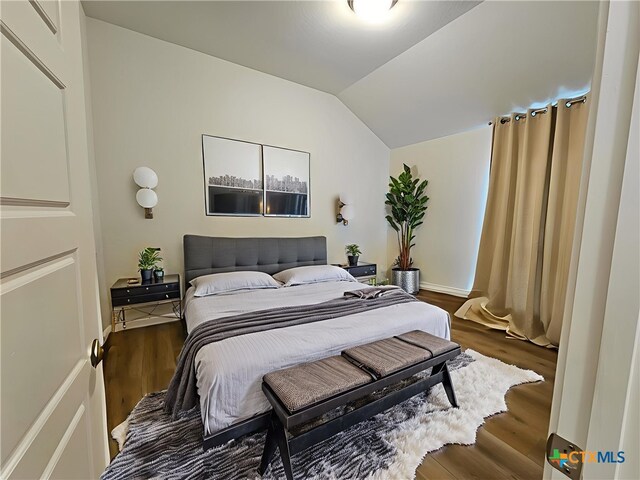 2961 Grove Way, Seguin, TX 78155 - bedroom with wood finished floors and lofted ceiling