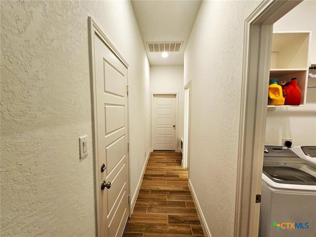 2961 Grove Way, Seguin, TX 78155 - corridor with wood finish floors, separate washer and dryer, and a textured wall