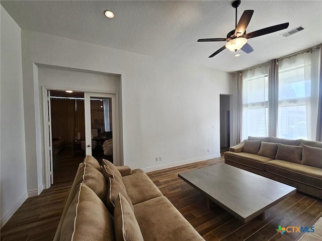 2961 Grove Way, Seguin, TX 78155 - living room featuring dark wood-type flooring, a ceiling fan, a textured ceiling, and recessed lighting