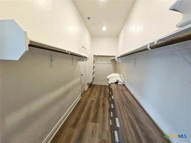 2961 Grove Way, Seguin, TX 78155 - spacious closet featuring dark wood finished floors