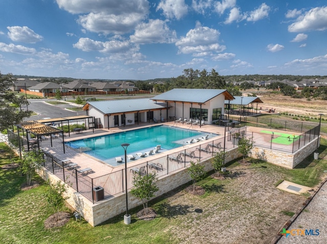 view of swimming pool with a patio