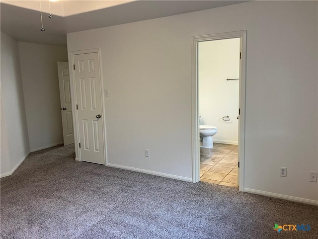 512 Constellation Dr, Killeen, TX 76542 - unfurnished bedroom featuring carpet floors, ensuite bathroom, and tile patterned floors