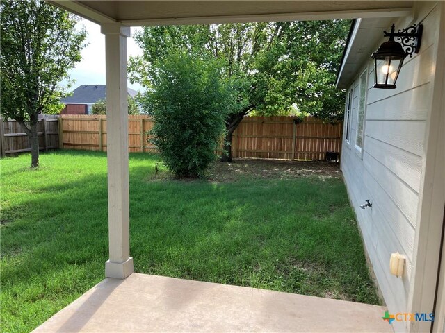512 Constellation Dr, Killeen, TX 76542 - fenced backyard with a patio area